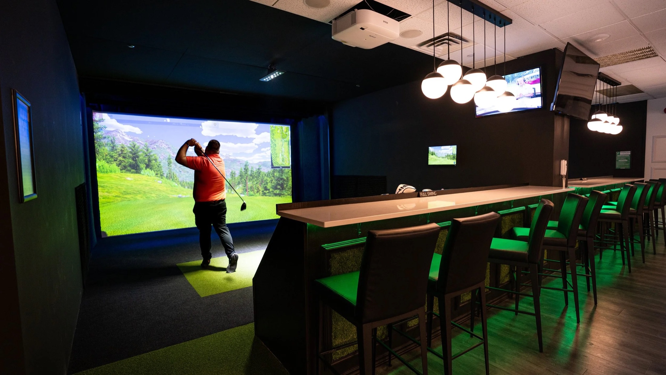 The glowing bay rail and simulator inside the lounge